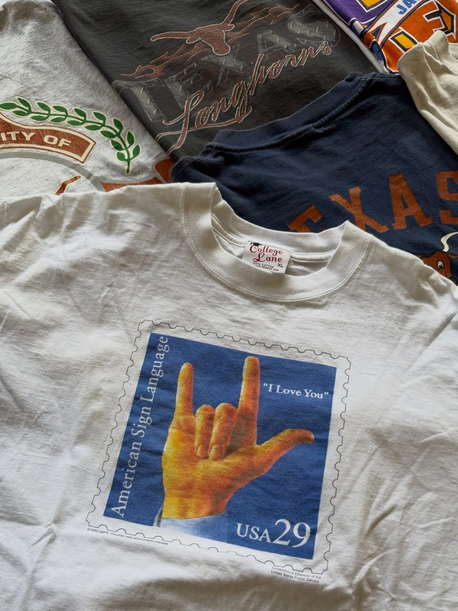 Vintage tee printed with the USPS American Sign Language I Love You stamp